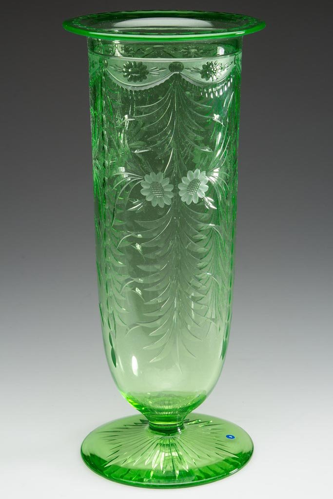 PAIRPOINT "WICKHAM" ENGRAVED VASE: PAIRPOINT "WICKHAM" ENGRAVED VASE, green, deep cylindrical bowl with flanged rim, raised on a star-cut foot. Pairpoint Corporation, New Bedford, MA. Circa 1925. 12" H, 5 1/8" D rim. Provenance: Proper