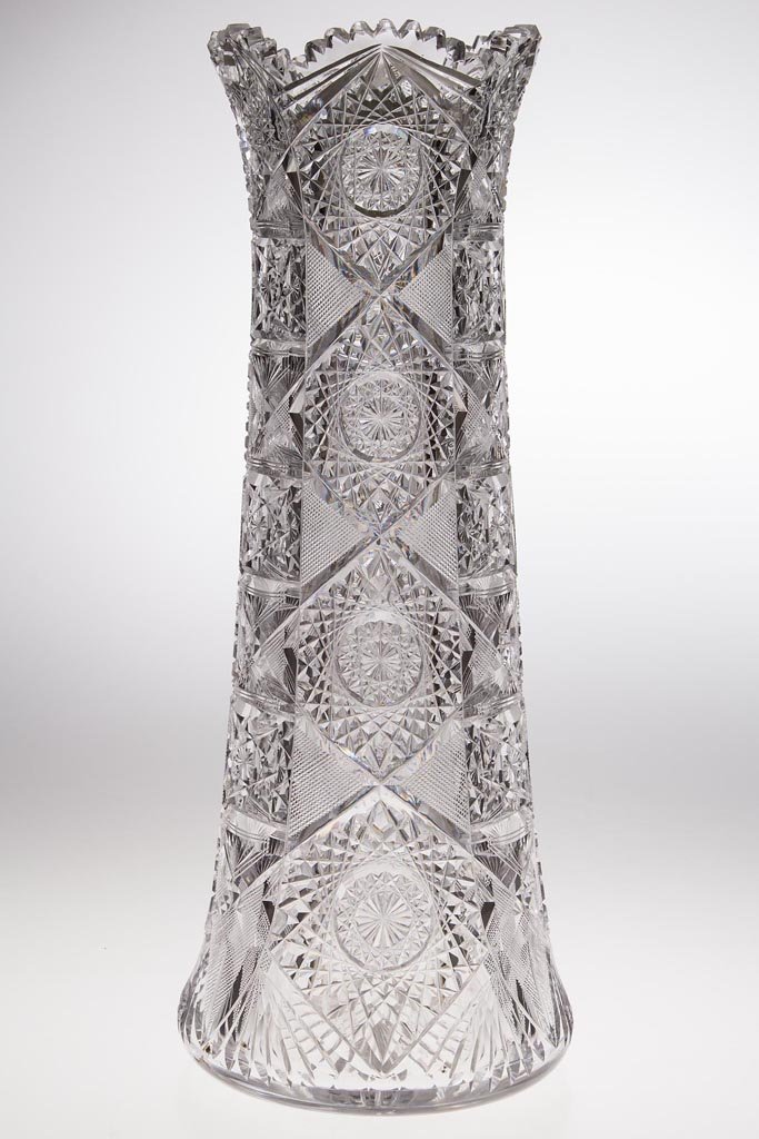 J. HOARE & CO "NO. 8019 / MONARCH" BRILLIANT CUT GLASS: J. HOARE & CO "NO. 8019 / MONARCH" BRILLIANT CUT GLASS VASE, colorless, waisted form with lightly flared circular scalloped sawtooth rim. J. Hoare & Co. Late 19th/early 20th century. 16" H, 6" D base.