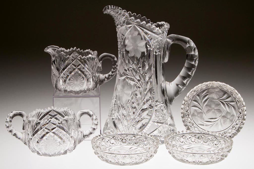 AMERICAN BRILLIANT CUT AND ENGRAVED GLASS ARTICLES, LOT: AMERICAN BRILLIANT CUT AND ENGRAVED GLASS ARTICLES, LOT OF SIX, colorless, various patterns with engraved flowers and geometrical patterns, comprising a J. Hoare creamer and open sugar set, each signe