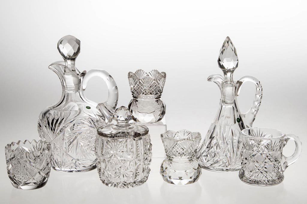 AMERICAN BRILLIANT CUT GLASS ARTICLES AND CONDIMENTS,: AMERICAN BRILLIANT CUT GLASS ARTICLES AND CONDIMENTS, LOT OF SEVEN, colorless, various diamond and hobstar patterns, comprising three toothpick holders, two cruets, mug, and a mustard jar. Late 19th/e