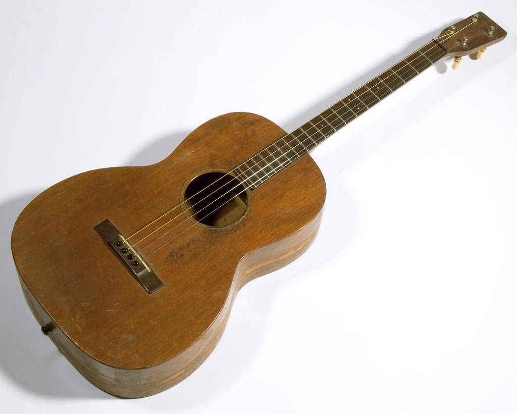 VINTAGE C. F. MARTIN & CO. ACOUSTIC TENOR GUITAR: VINTAGE C. F. MARTIN & CO. ACOUSTIC TENOR GUITAR, four strings, #31085, stamped on back of headstock and inside case. With modern soft case. Circa 1930. 31 1/2" L.