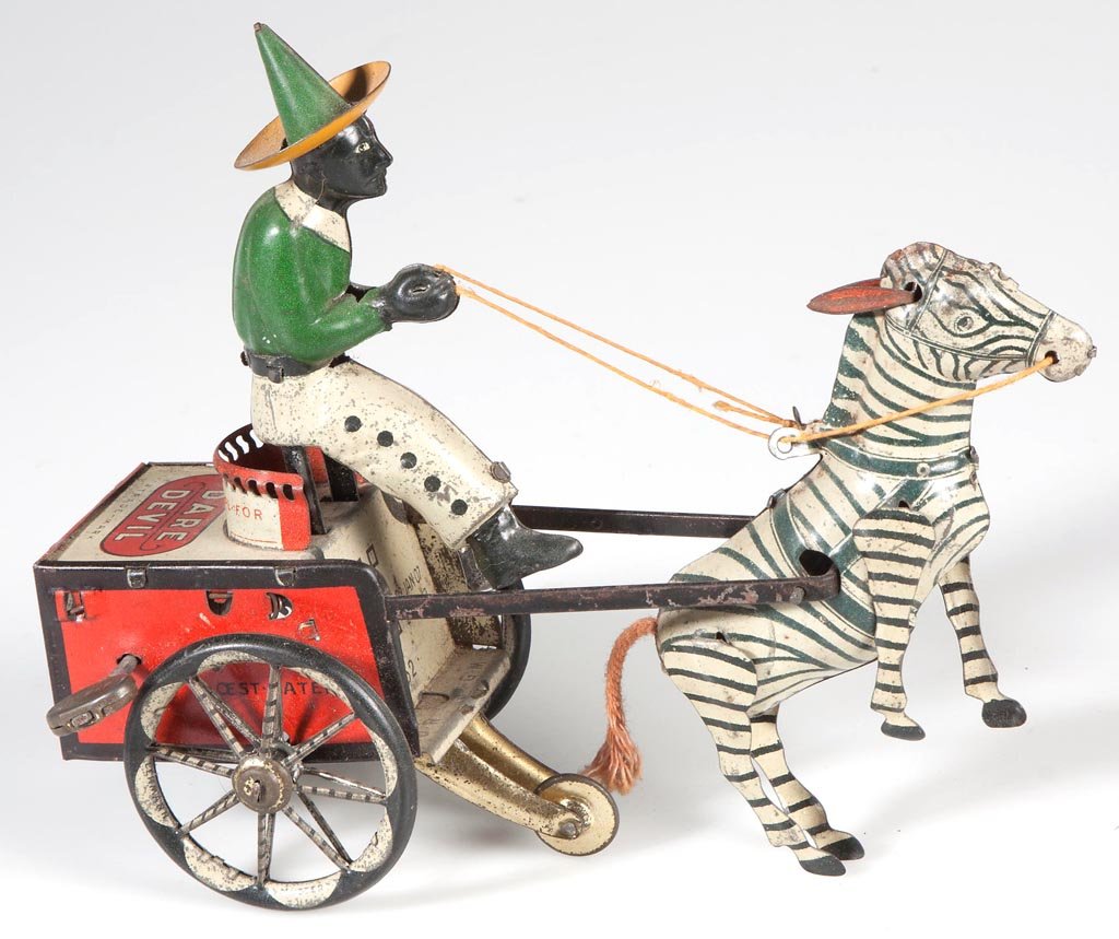 LEHMANN "DARE DEVIL" BALKY MULE WIND-UP TIN TOY: LEHMANN "DARE DEVIL" BALKY MULE WIND-UP TIN TOY, Black Americana driver. First quarter 20th century. 5 1/4" H, 7 1/4" L.