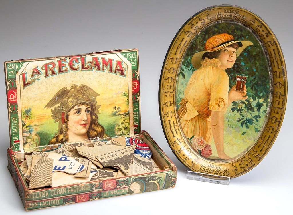 1916 COCA-COLA TIP TRAY: 1916 COCA-COLA TIP TRAY, lithographed tin. Together with a small cigar box containing puzzle pieces printed with advertising. First quarter 20th century. Tray 6" x 4 1/4". Provenance: From a Shenandoa