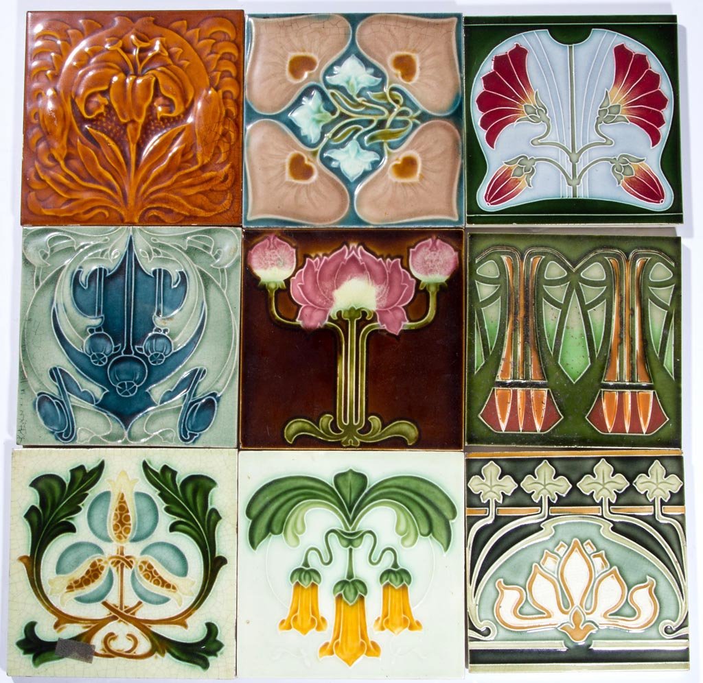 ASSORTED ART NOUVEAU GLAZED CERAMIC TILES, LOT OF NINE: ASSORTED ART NOUVEAU GLAZED CERAMIC TILES, LOT OF NINE, various floral designs, two marked with initials. 20th century. 6" SQ. Provenance: Collection of the late Margaret "Maggie" and Norwyn Rowe of W