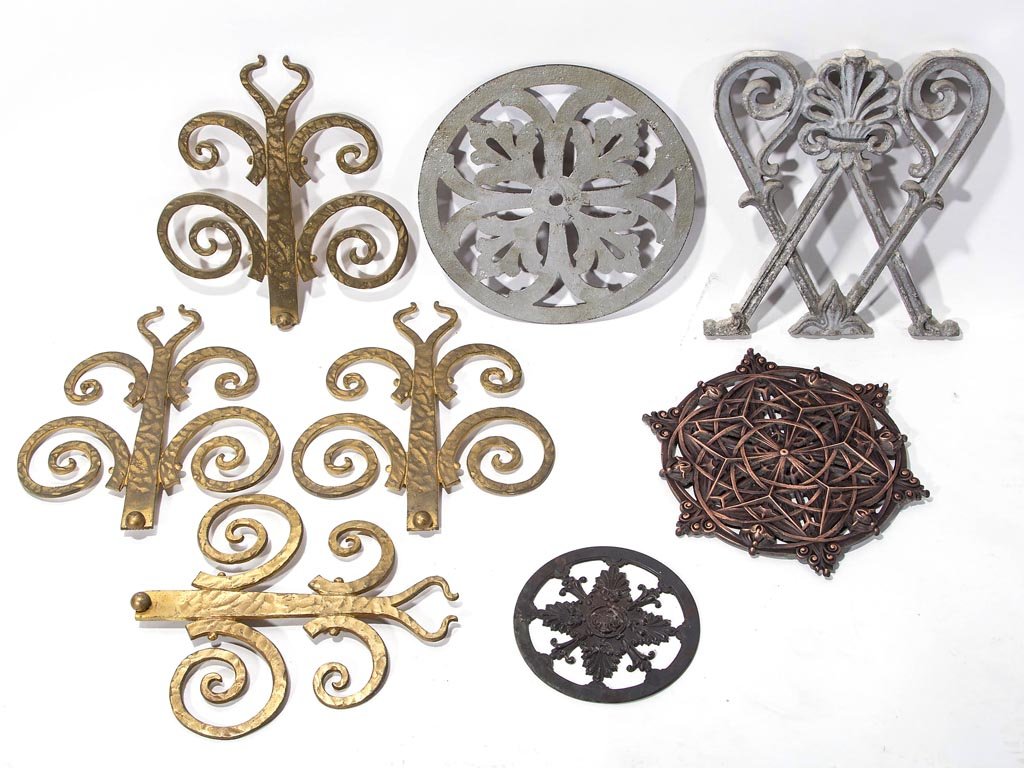 ARTS & CRAFTS AND OTHER METAL ORNAMENTS, LOT OF EIGHT: ARTS & CRAFTS AND OTHER METAL ORNAMENTS, LOT OF EIGHT, comprising cast-brass, cast-aluminum, and cast-iron examples. 20th century. Largest 11 1/2" x 10 1/2". Provenance: Collection of the late Margare