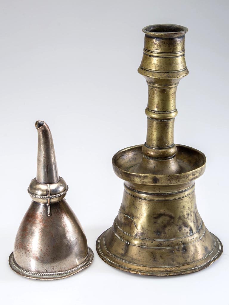 ANTIQUE DOMESTIC ARTICLES, LOT OF TWO: ANTIQUE DOMESTIC ARTICLES, LOT OF TWO, comprising an 18th century Sheffield plated-silver wine funnel with gadrooned rim and interior staining, and a 14th-15th century brass candlestick in two joined 