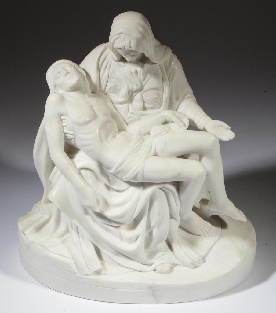 CARVED MARBLE STATUE AFTER MICHELANGELO'S "PIETA": CARVED MARBLE STATUE AFTER MICHELANGELO'S "PIETA", depicting Mary cradling Jesus in her lap, on an oval base, no signature located. 20th century. 16" H.