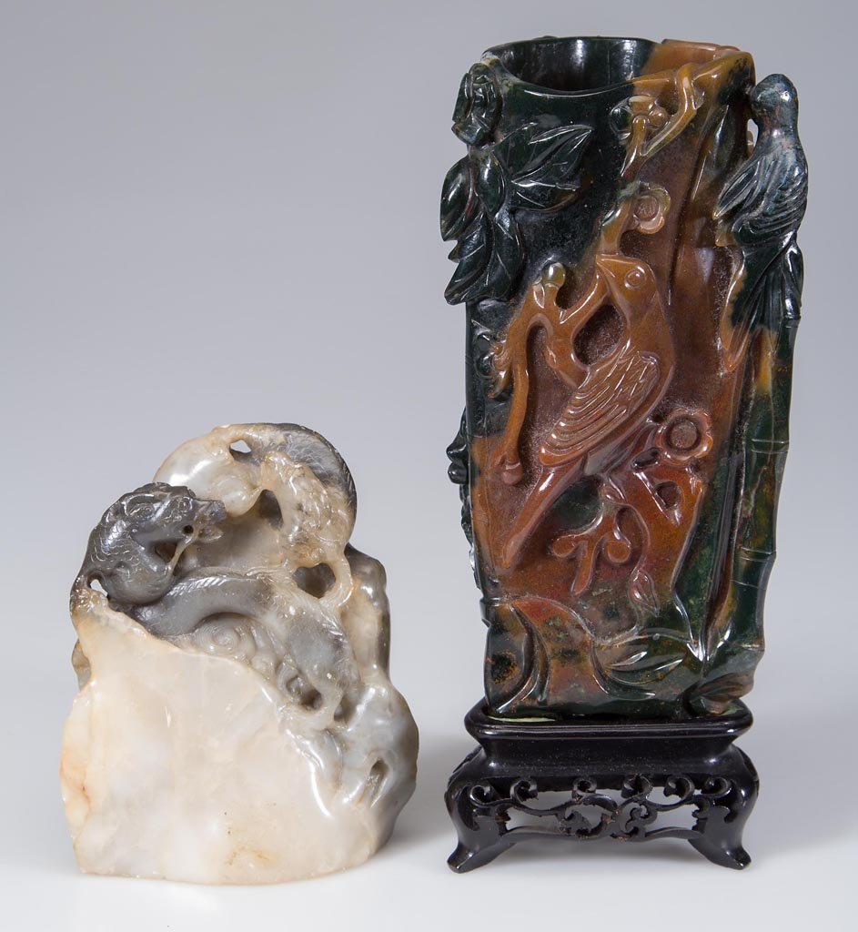 CHINESE SOAPSTONE AND BLOODSTONE CARVED VASES, LOT OF: CHINESE SOAPSTONE AND BLOODSTONE CARVED VASES, LOT OF TWO, the seal carved with two dragons in varying shades of off-white and grey; the triangular vase carved with birds in branches. Late Qing Dynast