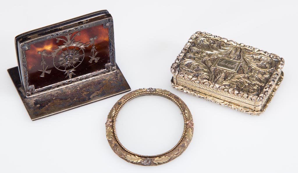ENGLISH GILDED SILVER VINAIGRETTE: ENGLISH GILDED SILVER VINAIGRETTE, ornate engraved acanthus leaf design with floral edging, interior hinged grill depicting scrolls and flowers, hallmarked for Birmingham and 1834. Together with a Bir