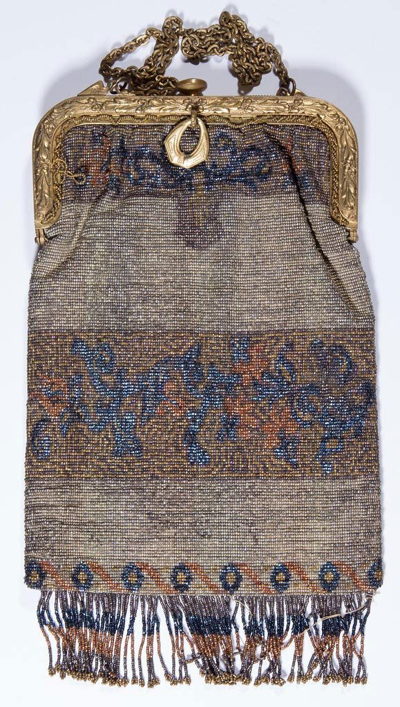 VINTAGE LADY'S BEADED PURSE: VINTAGE LADY'S BEADED PURSE, polychrome geometric design, marked French gold-tone metal frame, fringes, original chain and lining. First half 20th century. 4 3/4" x 8 3/4". Provenance: Collection of J