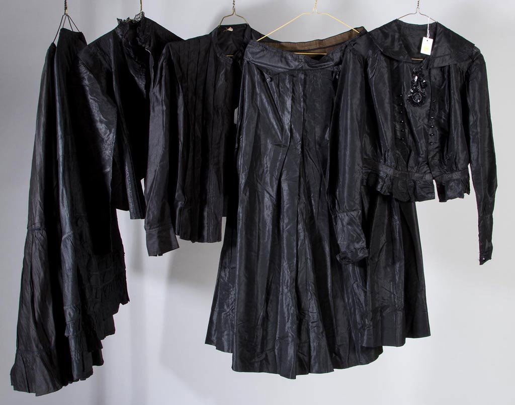 VINTAGE LADY'S CLOTHING ENSEMBLES, LOT OF THREE: VINTAGE LADY'S CLOTHING ENSEMBLES, LOT OF THREE, black cotton and silk, comprising three skirts including one with beading and another with droplet ornamentation, two jackets, and a blouse with beadin
