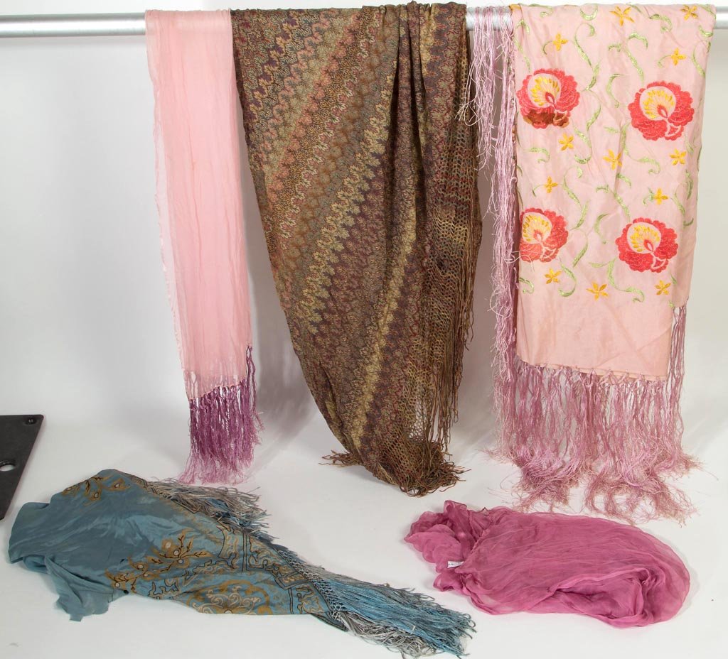 VINTAGE LADY'S CLOTHING ACCESSORIES, LOT OF FIVE: VINTAGE LADY'S CLOTHING ACCESSORIES, LOT OF FIVE, silk and rayon, comprising three shawls with fringe, including a light pink and a teal green embroidered example, and an example with bands of stylize