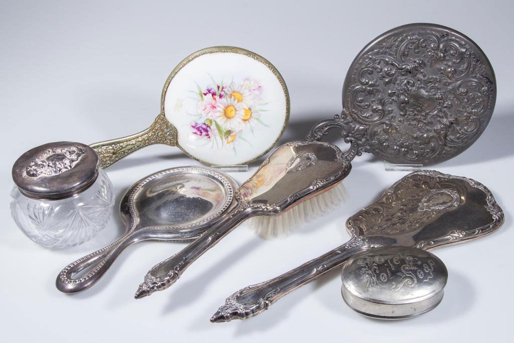 ASSORTED SILVER AND OTHER DRESSER ARTICLES, LOT OF: ASSORTED SILVER AND OTHER DRESSER ARTICLES, LOT OF SEVEN, including a sterling silver hair brush and matching hand mirror, and another sterling silver hand mirror, remainder silver-plate. Late 19th/fi