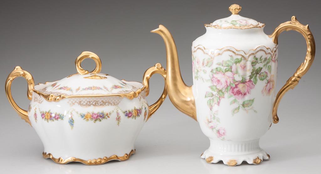 LIMOGES, FRANCE PORCELAIN SERVING ARTICLES, LOT OF TWO: LIMOGES, FRANCE PORCELAIN SERVING ARTICLES, LOT OF TWO, polychrome floral decorations with heavy gilding, comprising a two-handle biscuit jar with green J. Pouyat marks and Wanamaker's retailer mark,