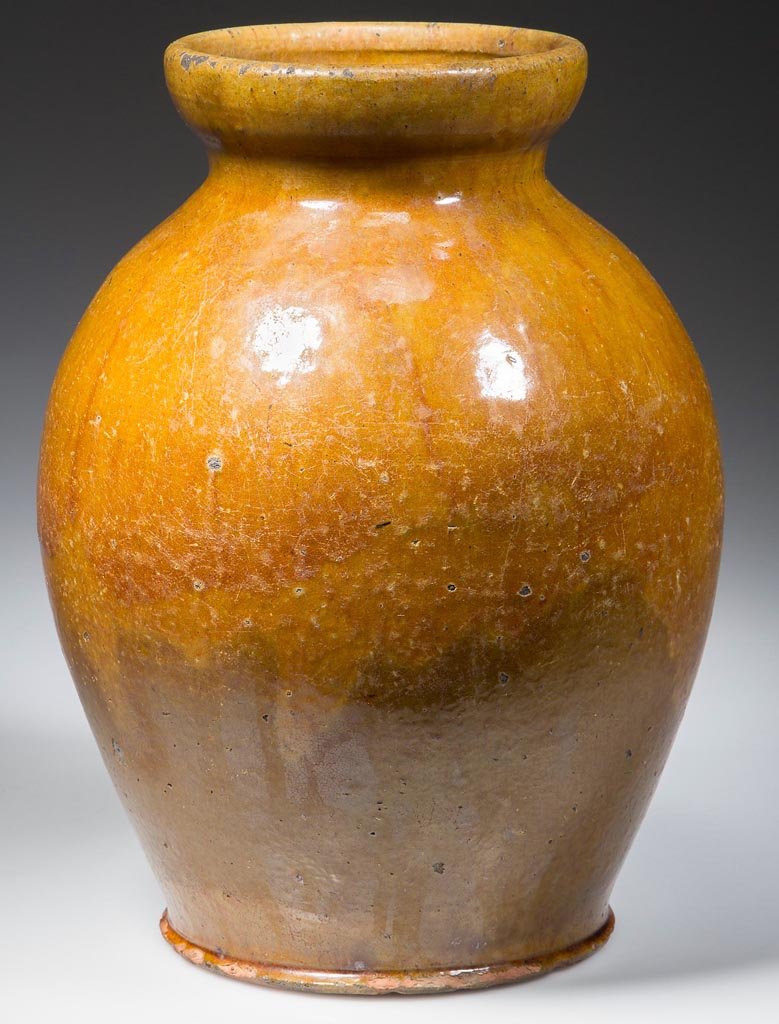 VALLEY OF VIRGINIA EARTHENWARE / REDWARE STORAGE JAR: VALLEY OF VIRGINIA EARTHENWARE / REDWARE STORAGE JAR, lead- and copper-glazed, bold ovoid form with a deep galleried rim and delicate beaded foot, not glazed under base. Probably Southwestern Virginia