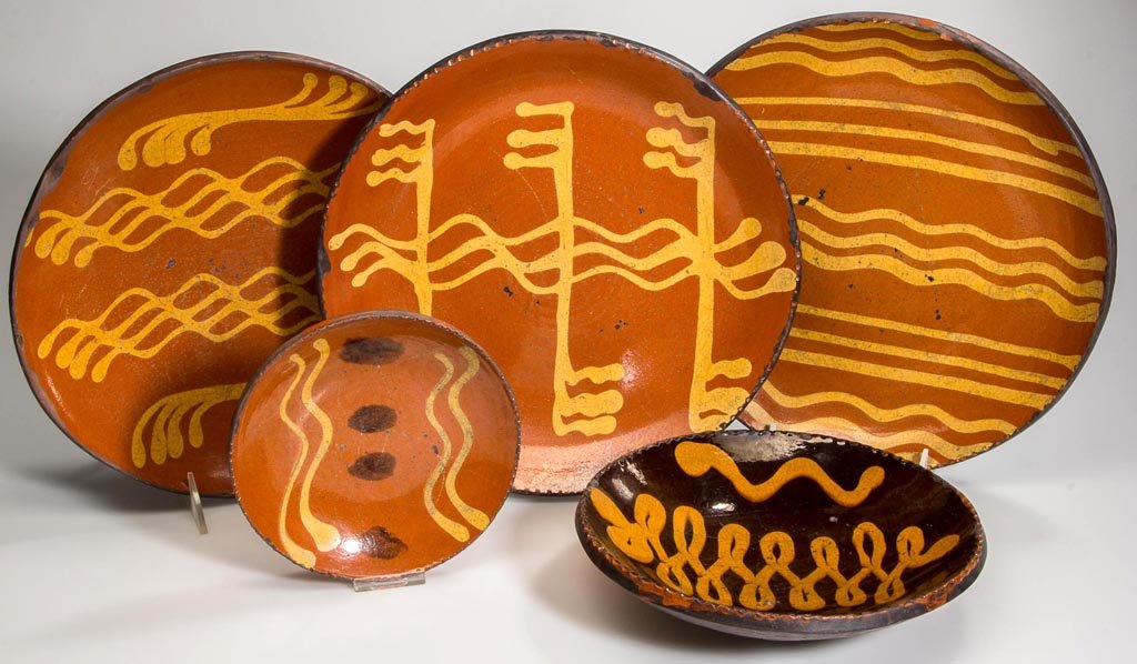 GREG SHOONER REPRODUCTION EARTHENWARE / REDWARE PLATES,: GREG SHOONER REPRODUCTION EARTHENWARE / REDWARE PLATES, LOT OF FIVE, lead-glazed with slipped decorations, each signed and stamped on reverse. Dated 1995-2006. 10 7/8" D largest. Provenance: Collectio