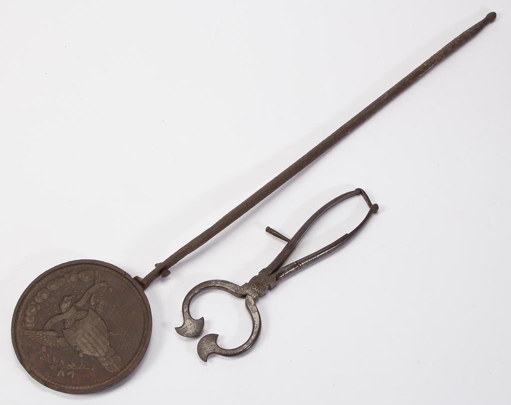WROUGHT-IRON HANDLED SUGAR NIPPERS: WROUGHT-IRON HANDLED SUGAR NIPPERS, punched and engraved ornamentations to hinge area and handles, original closure clip. Stamped "R. TIMMINS / & SONS" on one arm. Together with a cast- and wrought-ir