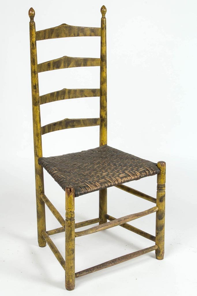 PENNSYLVANIA SMOKE-DECORATED LADDER-BACK SIDE CHAIR: PENNSYLVANIA SMOKE-DECORATED LADDER-BACK SIDE CHAIR, the back with four peaked slats and turned finials, above a woven white-oak splint seat raised on turned front legs. Early yellow-painted surface w