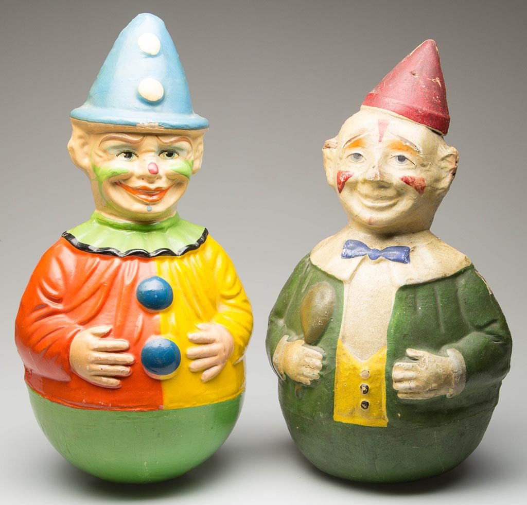 GERMAN PAPIER-MACHE ROLY-POLY FIGURES, LOT OF TWO: GERMAN PAPIER-MACHE ROLY-POLY FIGURES, LOT OF TWO, each with conical hat and polychrome-painted surface. Larger example with old label for "Rolly Toys / Made in West Germany" underneath. Smaller examp