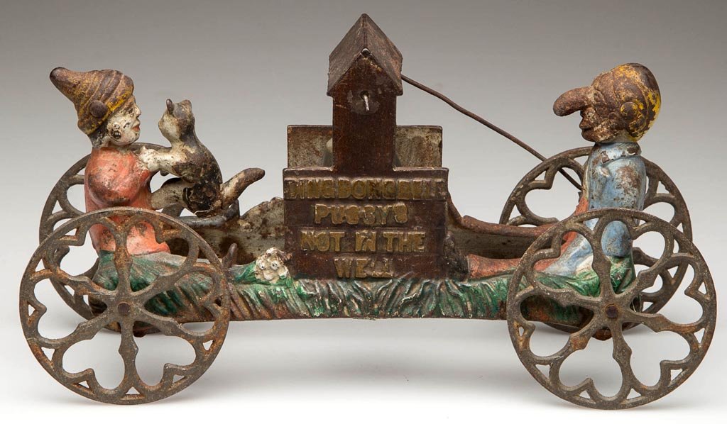 "DING DONG BELL / PUSSYS / NOT IN THE / WELL" CAST-IRON: DING DONG BELL / PUSSYS / NOT IN THE / WELL CAST-IRON BELL TOY, on cast-iron heart-design wheels. Original worn polychrome-painted surfaces. Circa 1890-1900. 4 1/2" H, 9 1/4" L. Provenance: Collection