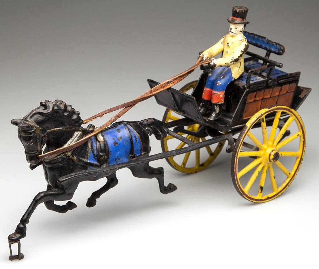 PRATT & LETCHWORTH CAST-IRON HORSE-DRAWN DOG CART TOY: PRATT & LETCHWORTH CAST-IRON HORSE-DRAWN DOG CART TOY, single horse lacking front wheel, open-bench seat with compartment in back to carry dogs, with driver. Original polychrome-painted surface. Circa