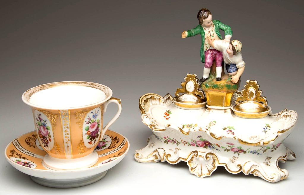 FRENCH PARIS PORCELAIN ARTICLES, LOT THREE: FRENCH PARIS PORCELAIN ARTICLES, LOT THREE, comprising a Jacob Petit Rococo-style inkstand with shell molding, two wells with inserts and covers, and a bolted central sculptural embellishment of two b