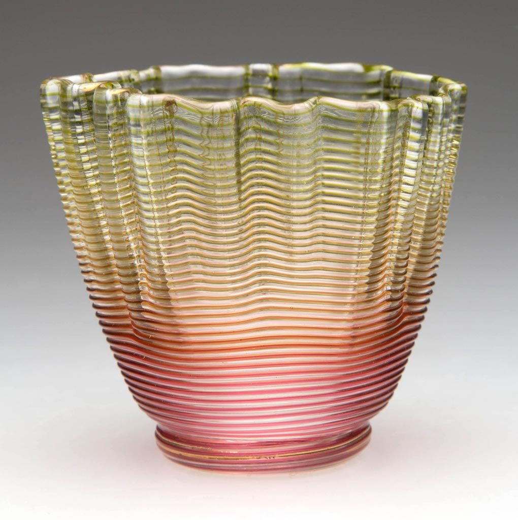 THREADED-GLASS TOOTHPICK HOLDER: THREADED-GLASS TOOTHPICK HOLDER, colorless with apple green and cranberry threading. Fourth quarter 19th century. 2 1/8" H. Provenance: From the collection of Betty and Jim MaGuire.