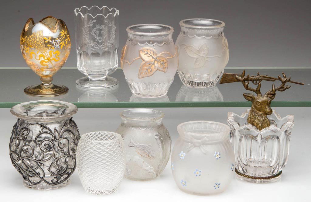 ASSORTED VICTORIAN AND OTHER TOOTHPICK HOLDERS, LOT OF: ASSORTED VICTORIAN AND OTHER TOOTHPICK HOLDERS, LOT OF NINE, including two Flower and Pleat, Pleat and Bow, and Fish in Pond. Fourth quarter 19th/early 20th century. 1 7/8" to 3 1/2" HOA. Provenance: