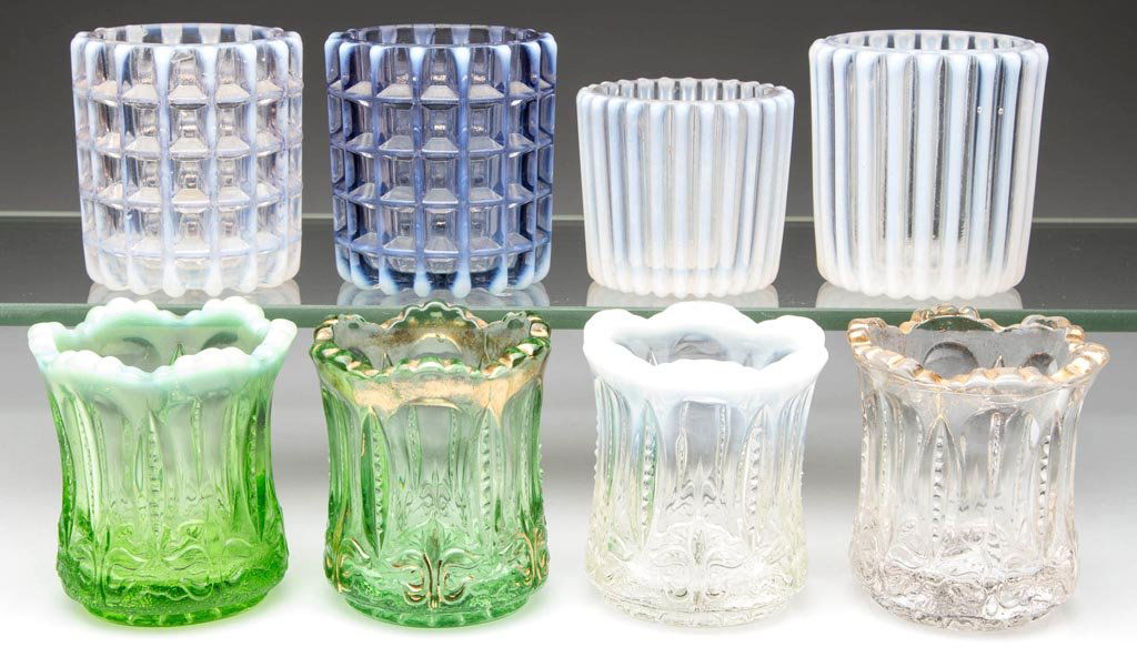 OPALESCENT AND OTHER GLASS TOOTHPICK HOLDERS, LOT OF: OPALESCENT AND OTHER GLASS TOOTHPICK HOLDERS, LOT OF EIGHT, various colors, including four Iris with Meander, two green and two colorless, a gilt-decorated example and opalescent example in each color
