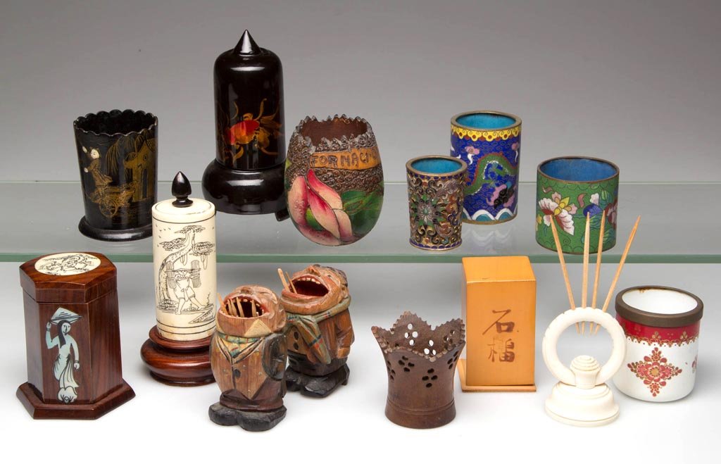 ASSORTED MATERIALS TOOTHPICK HOLDERS, LOT OF 14: ASSORTED MATERIALS TOOTHPICK HOLDERS, LOT OF 14, including Cloisonné, carved wood, enamel, and lacquered. Late 19th and 20th century. 1 3/4" to 4 3/4" H. Provenance: From the collection of Betty and