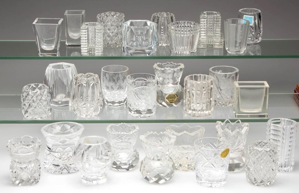 ASSORTED CUT, ENGRAVED AND RELATED GLASS TOOTHPICK: ASSORTED CUT, ENGRAVED AND RELATED GLASS TOOTHPICK HOLDERS, LOT OF 29, colorless, including Waterford and Bohemian examples. 20th century. 1 7/8" to 2 7/8" H. Provenance: From the collection of Betty