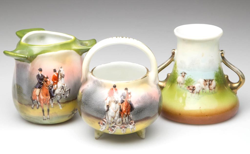 ROYAL BAYREUTH PORCELAIN TOOTHPICK HOLDERS, LOT OF: ROYAL BAYREUTH PORCELAIN TOOTHPICK HOLDERS, LOT OF THREE, comprising two Horsewoman / Horseman examples, and a Highland Sheep. Two with printed blue mark to underside. Circa 1900-1920. 2 1/2" and 3" H