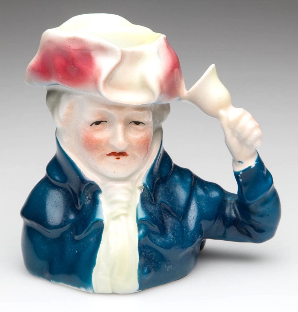 ROYAL BAYREUTH PORCELAIN TOOTHPICK HOLDER: ROYAL BAYREUTH PORCELAIN TOOTHPICK HOLDER, in the form of an 18th century "Bell Ringer," underside with blue printed mark. Circa 1920-1930. 3 1/2" HOA. Provenance: Collection of Lyle and Doris Davis.