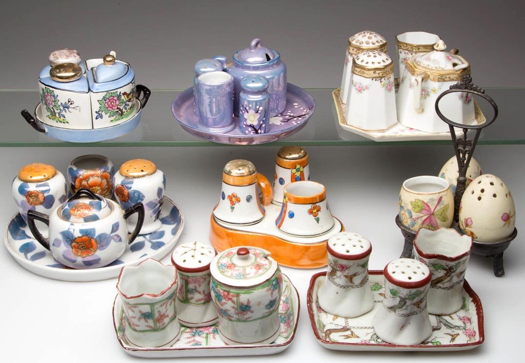 ASSORTED CERAMIC COMBINATION CONDIMENT SETS, LOT OF: ASSORTED CERAMIC COMBINATION CONDIMENT SETS, LOT OF EIGHT, each four or five piece set including tray/stand, including Nippon. Late 19th/first half 20th century. Various sizes. Provenance: From the co