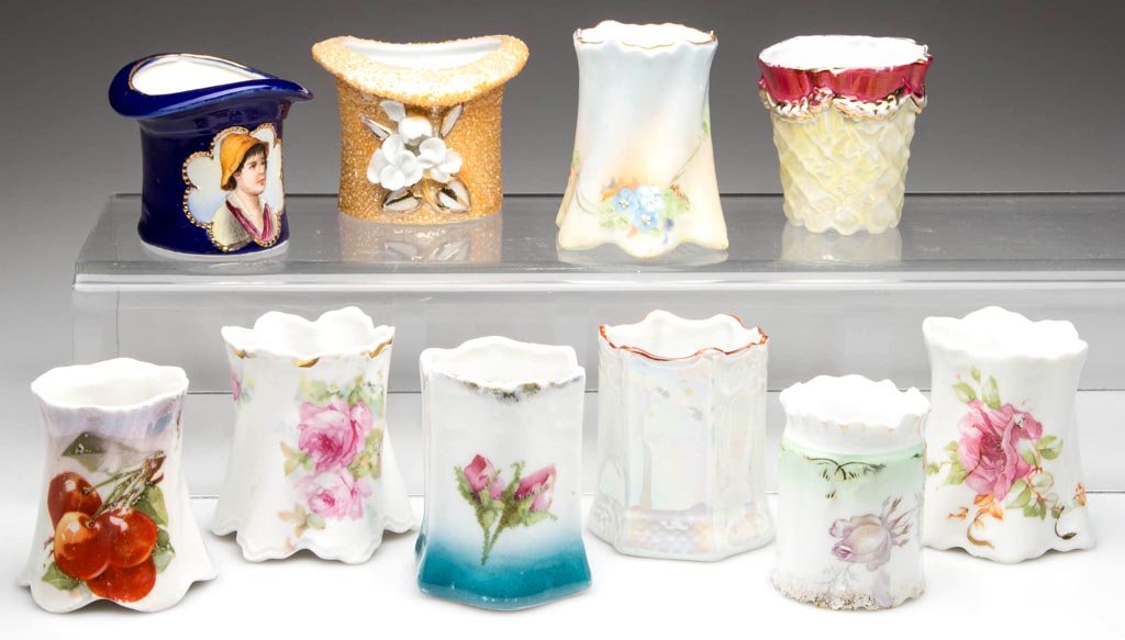 CONTINENTAL PORCELAIN TOOTHPICK HOLDERS, LOT OF TEN: CONTINENTAL PORCELAIN TOOTHPICK HOLDERS, LOT OF TEN, mostly German examples, including two hats, one by Royal Medallion. Various marks. 20th century. 2 7/16" HOA.