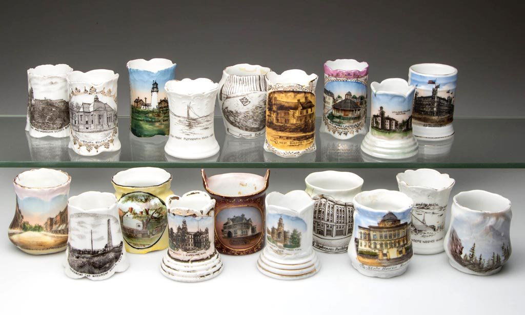 GERMAN CHINA SOUVENIR TOOTHPICK HOLDERS, LOT OF 19: GERMAN CHINA SOUVENIR TOOTHPICK HOLDERS, LOT OF 19, including Ohio, Pennsylvania, West Virginia, Massachusetts, Maine, Iowa, and Oklahoma. Late 19th/first quarter 20th century. 2 1/4" to 2 1/2" H. Pro