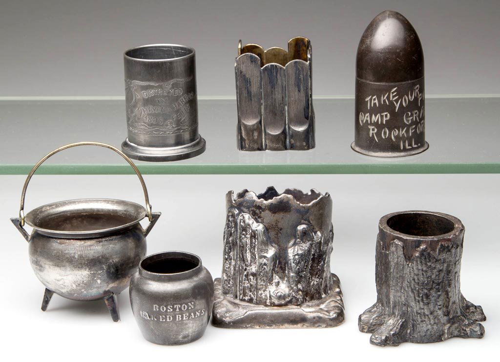 VICTORIAN SILVER-PLATE FIGURAL TOOTHPICK HOLDERS, LOT: VICTORIAN SILVER-PLATE FIGURAL TOOTHPICK HOLDERS, LOT OF SEVEN, including a Battleship Maine commemorative example and a shell-from engraved "Take Your Pick / Camp Grant / Rockford, Ill.", markings in