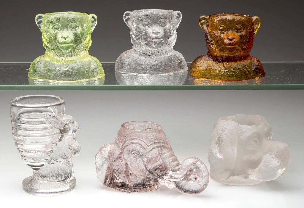 ASSORTED FIGURAL GLASS TOOTHPICK HOLDERS, LOT OF SIX: ASSORTED FIGURAL GLASS TOOTHPICK HOLDERS, LOT OF SIX, comprising three Darwin. Fourth quarter 19th century. 2 1/4" to 3 1/2" H. Provenance: From the collection of Betty and Jim MaGuire.