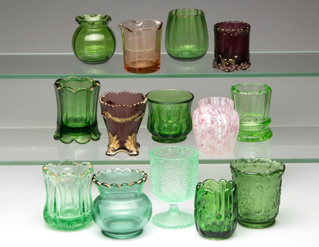 ASSORTED COLORED EAPG TOOTHPICK HOLDERS, LOT OF 11: ASSORTED COLORED EAPG TOOTHPICK HOLDERS, LOT OF 11, including olive green Sultan. Late 19th/early 20th century. 2 1/8" to 3 1/8" H. Provenance: From the collection of Betty and Jim MaGuire.