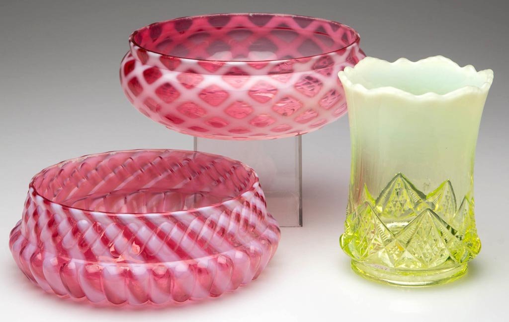 ASSORTED OPALESCENT GLASS ARTICLES, LOT OF THREE: ASSORTED OPALESCENT GLASS ARTICLES, LOT OF THREE, comprising a vaseline (uranium) Diamond Spearhead spooner, a cranberry Chrysanthemum Swirl bowl, and a cranberry Lattice bowl. Fourth quarter 19th/ear