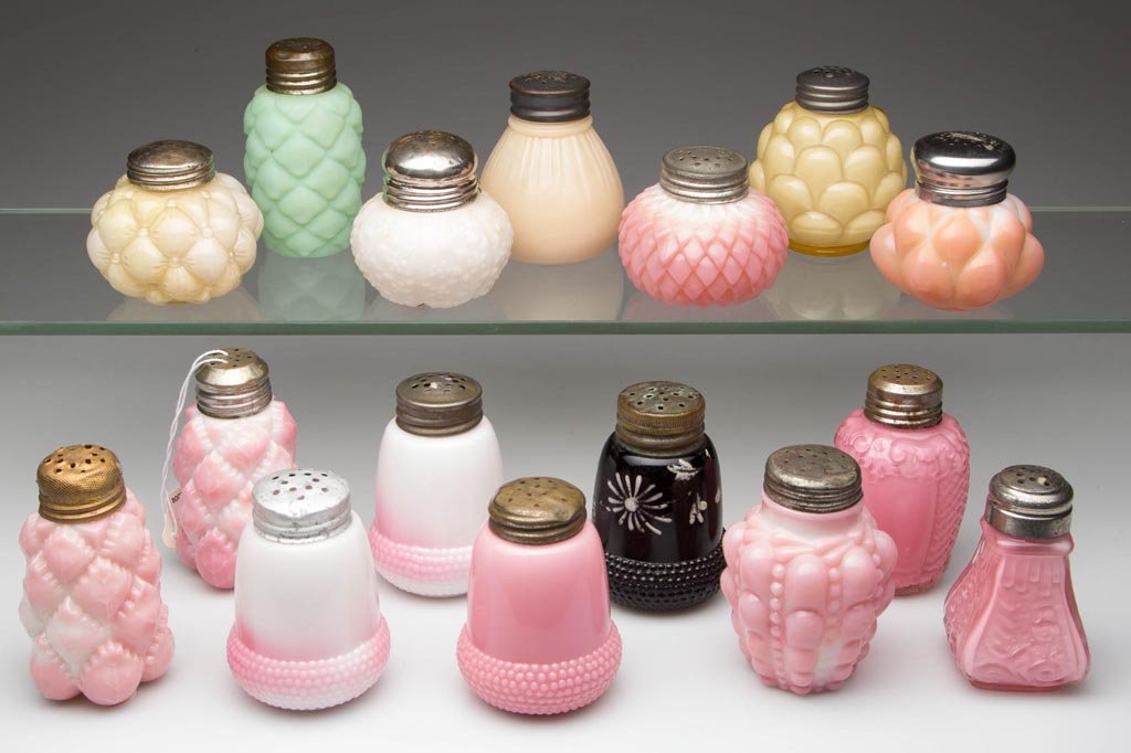ASSORTED CASED AND OPAQUE GLASS SALT AND PEPPER: ASSORTED CASED AND OPAQUE GLASS SALT AND PEPPER SHAKERS, LOT OF 16, various colors, comprising 12 opaque examples including an Acorn and Pineapple pair in opaque white and pink; green with satin finis
