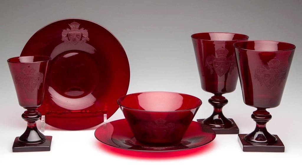 CONTINENTAL HERALDIC GLASS TABLE ARTICLES, LOT OF SIX: CONTINENTAL HERALDIC GLASS TABLE ARTICLES, LOT OF SIX, deep ruby, comprising two goblets, two plates, one wine glass, and one dish, each engraved with a coat of arms featuring a crown crest. 19th or e