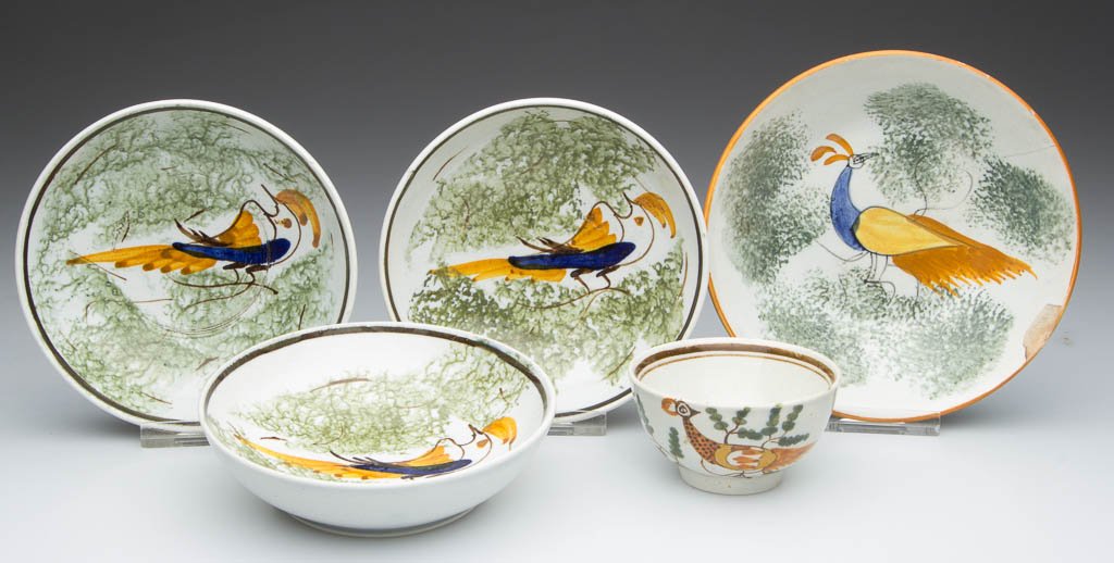 ENGLISH STAFFORDSHIRE POTTERY PEARLWARE PEAFOWL TOY TEA: ENGLISH STAFFORDSHIRE POTTERY PEARLWARE PEAFOWL TOY TEA BOWL AND SAUCERS, LOT OF FIVE, comprising three identical saucers with brown line rims enclosing a very abstracted bird on branches, between two