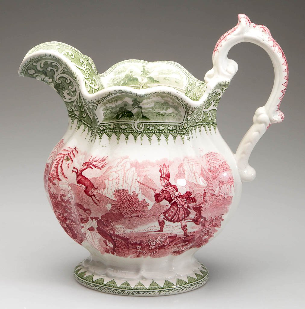 WILLIAM ADAMS STAFFORDSHIRE POTTERY "CALEDONIA": WILLIAM ADAMS STAFFORDSHIRE POTTERY "CALEDONIA" TWO-COLOR TRANSFER-PRINTED PITCHER, with red reserve, the center in green. Marked to underside and impressed ADAMS. Circa 1840-1860. 9 3/4" H.