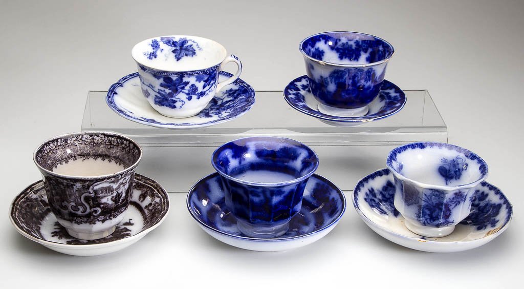 ENGLISH IRONSTONE POTTERY TEA BOWL AND SAUCER SETS, LOT: ENGLISH IRONSTONE POTTERY TEA BOWL AND SAUCER SETS, LOT OF THREE, including mulberry "Corean" and flow blue "Chapoo" patterns. Together with a later "Lonsdale" cup and saucer, and two odd articles. Te