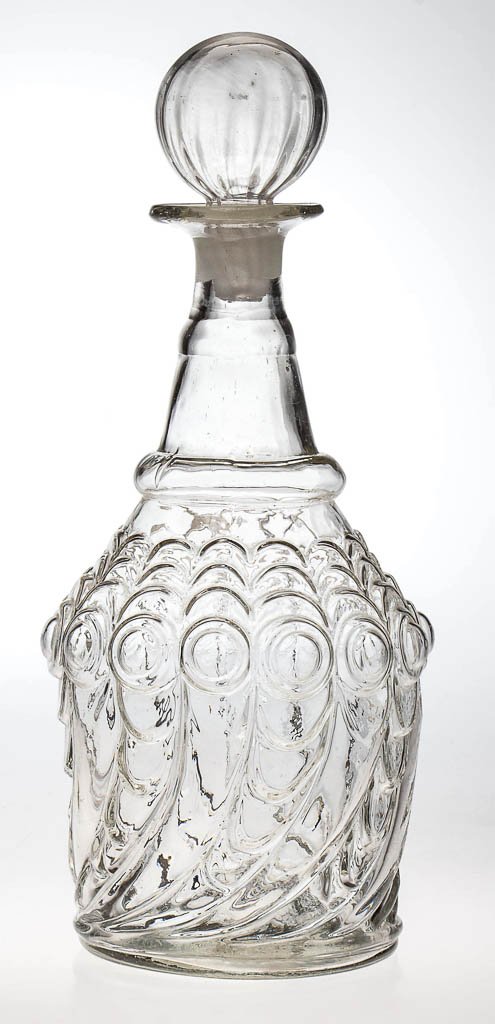 BLOWN-MOLDED GV-17 QUART DECANTER: BLOWN-MOLDED GV-17 QUART DECANTER, colorless, two blown-out neck rings, flanged mouth, plain base with rough pontil mark, period hollow lightly-ribbed globular stopper. Boston & Sandwich Glass Co. Cir