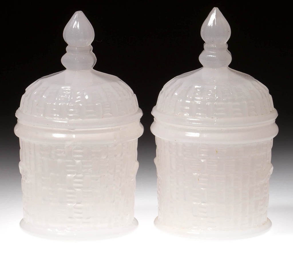 PRESSED COVERED BASKET POMADE / TOOTHPICK HOLDERS, LOT: PRESSED COVERED BASKET POMADE / TOOTHPICK HOLDERS, LOT OF TWO, alabaster/clambroth, small size, base with decorative handles, cover with a ribbed and knopped finial. Boston & Sandwich Glass Co. Circa