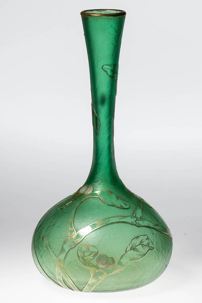 FRENCH DAUM NANCY ACID CUT-BACK VASE: FRENCH DAUM NANCY ACID CUT-BACK VASE, green with gilt and enamel highlights, Iris-like decorations, gilt signature under base. France. Circa 1890-1920. 6 1/2" H, 3 3/8" DOA. Provenance: Collection of