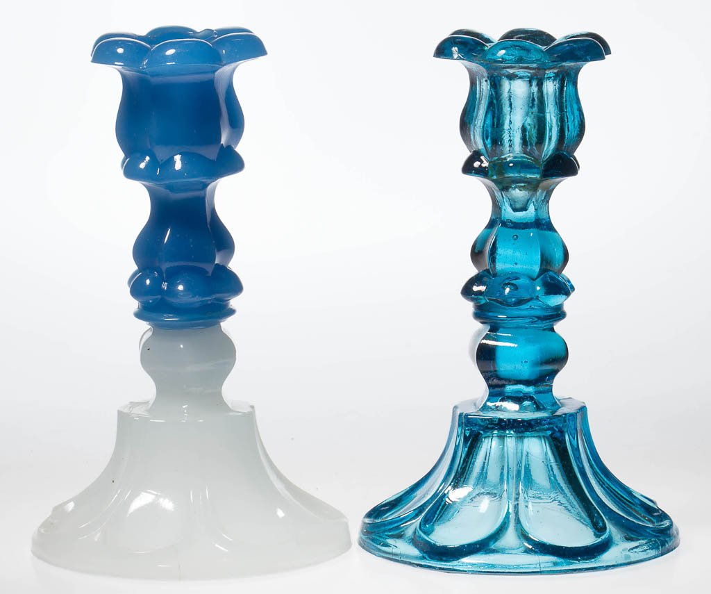 PRESSED PETAL AND LOOP CANDLESTICKS, LOT OF TWO: PRESSED PETAL AND LOOP CANDLESTICKS, LOT OF TWO, medium electric blue, and translucent starch blue above alabaster/clambroth, each six-petal socket with a hexagonal extension, raised on a hexagonal kn