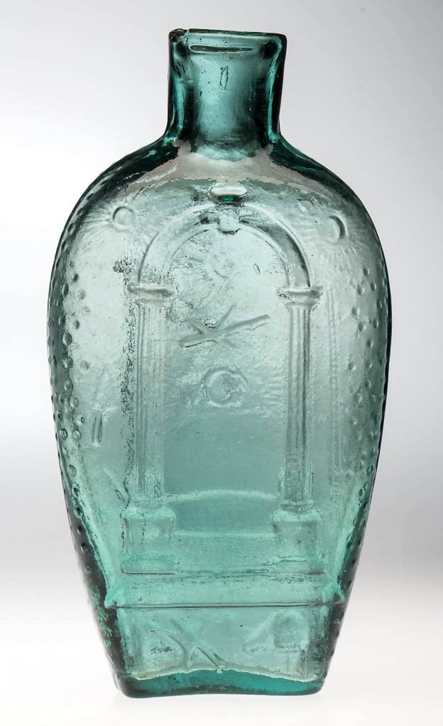 GIV-28 MASONIC ARCH PICTORIAL FLASK: GIV-28 MASONIC ARCH PICTORIAL FLASK, blue green, half-pint, dotted sides, sheared mouth, faint rough pontil mark. United States. Circa 1840-1860. 6 1/2" H. Provenance: Property from the Trestle Brook 